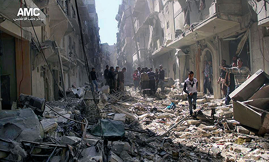 Syrians inspect the rubble of destroyed buildings