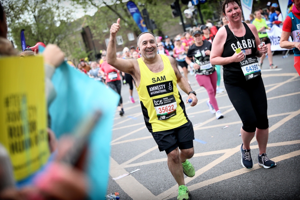 Team Amnesty runner running during London Marathon 2024