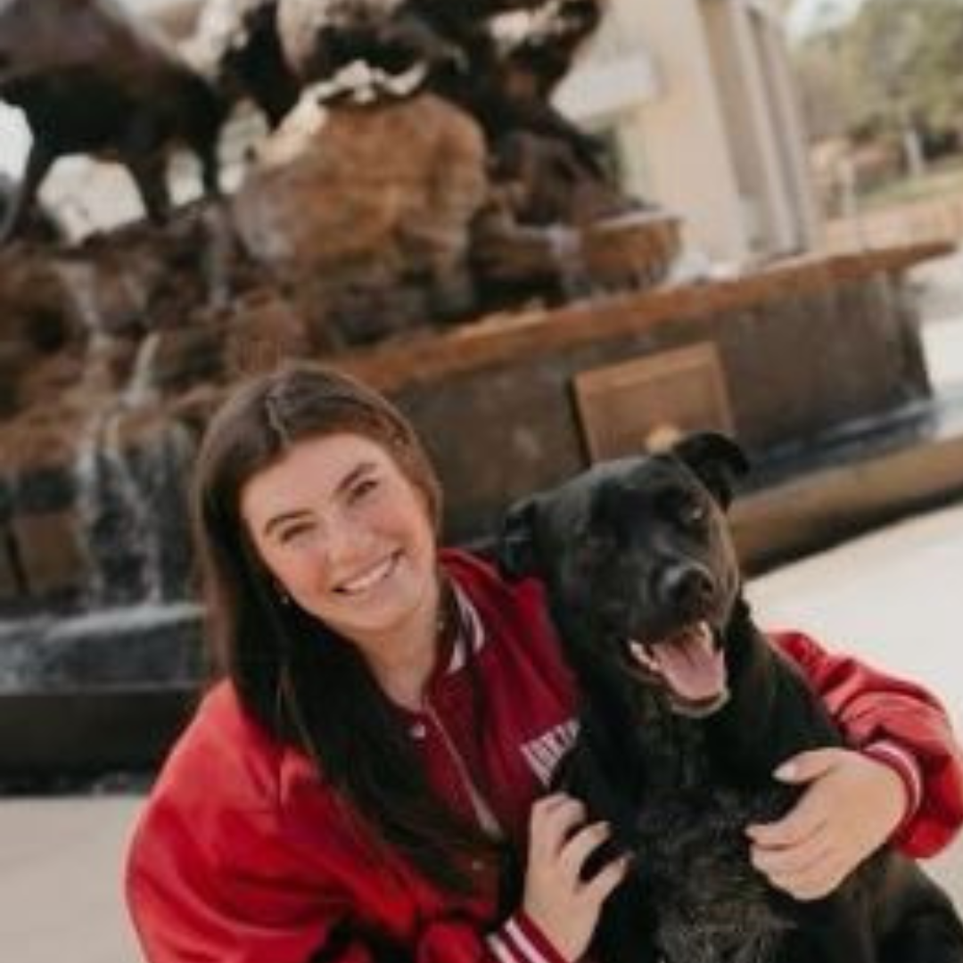 Smiling person with dog