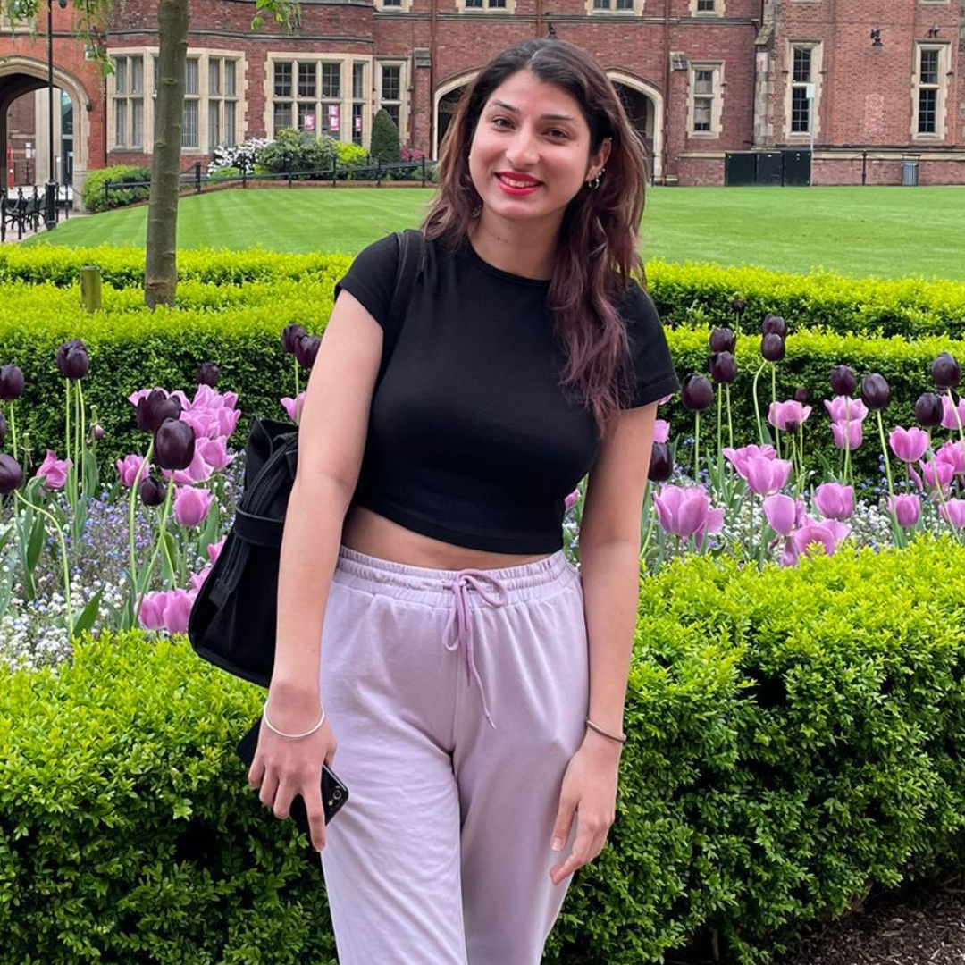 Smiling woman wearing black tshirt and sweatpants