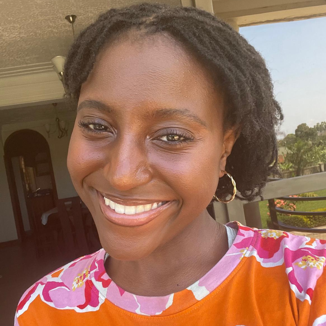 Smiling woman with orange top on