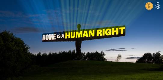 Home is a human right projected on angel of the north