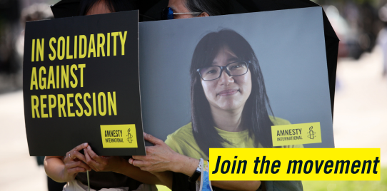 A picture of two Amnesty placards, one saying "in solidarity against repression and the other with a picture of chow hang tung