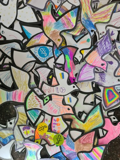 A collage of the Peace Doves coloured in by children at events in 2023