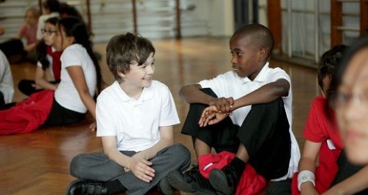 School children sitting in their school hall