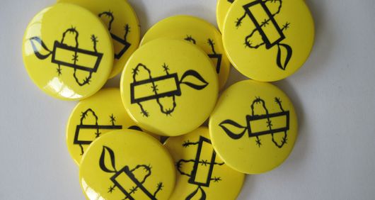 Amnesty Candle Pin Badges Yellow (Bag of 10)