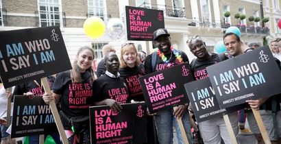 AIUK activists marching at London Pride