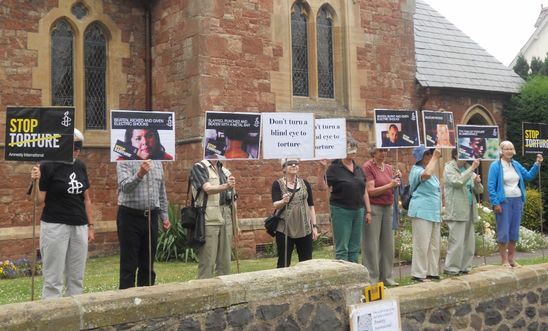 MInead Group members holding banners and large posters