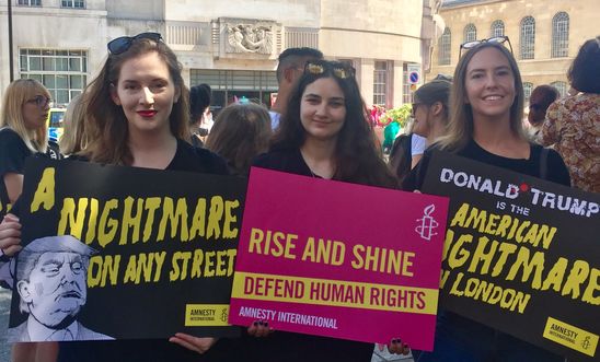 Women protesting President Trump's visit to the UK