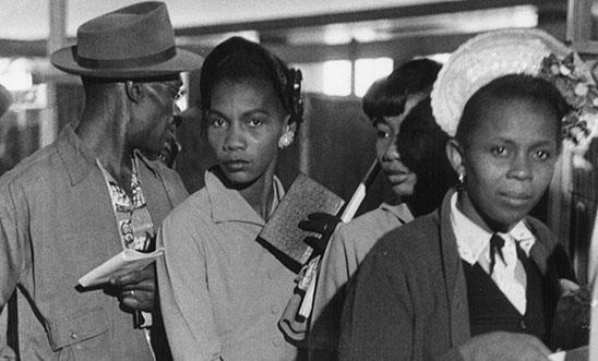 mmigrants to Britain from the West Indies queuing up on arrival at Southampton holding documents 27 May 1956