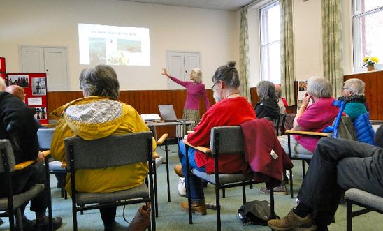 People listening to a speaker