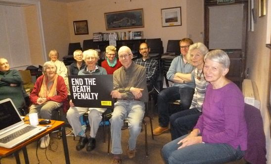 Amnesty members with a speaker