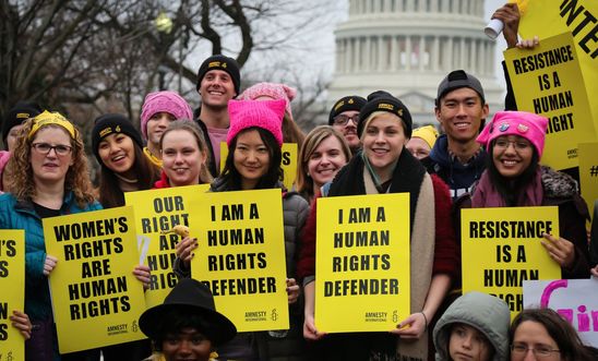 Amnesty members declaring that they are human rights defenders