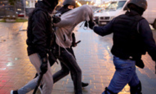 Law enforcement officers detain a man during a rally of opposition supporters to protest the country's presidential inauguration in Minsk on September 27, 2020