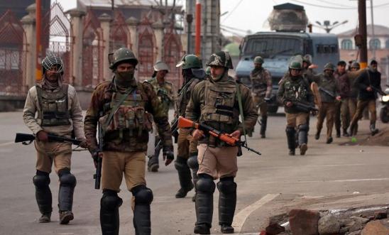 Photo of armed soldiers on a road