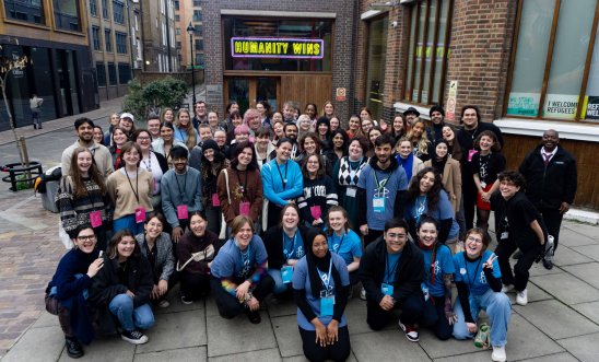 A group of students posing for a photo outside Amnesty UK's London office