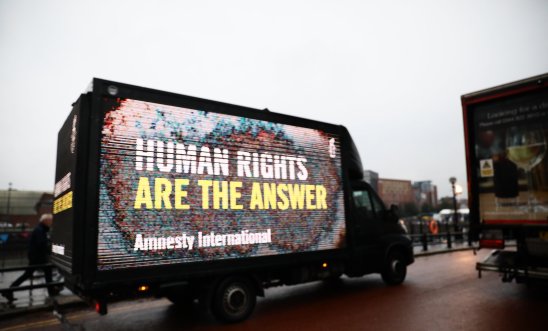 Van that reads: Human rights are the answer