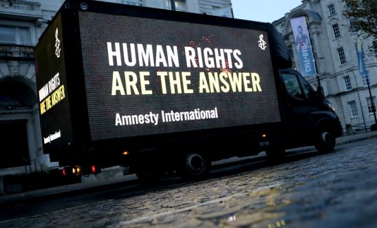 Van that reads: Human rights are the answer