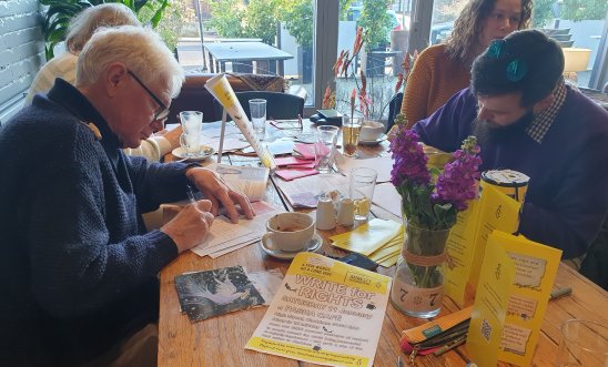 card signing in the cafe