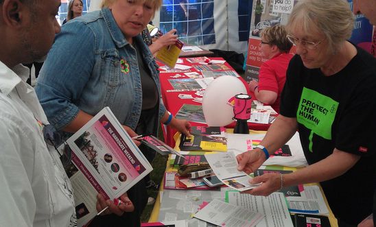 Signing cards at Amnesty stall